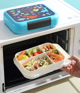 Putting cartoon dinosaur lunch box with 4 compartments into microwave for heating