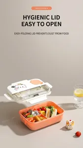 Three-compartment bento box with cartoon bear lid, showing organized sandwich and snacks