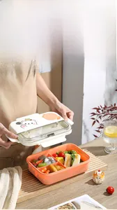 Three-compartment bento box with cartoon bear lid, showing organized sandwich and snacks