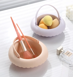 Detail of portable silicone makeup brush cleaning bowl and beauty sponge drying rack