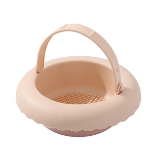 Pink silicone makeup brush cleaning bowl with portable handle and textured bottom