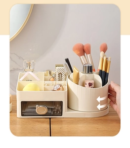 Rotating makeup organizer detail showing brush holder and drawer with bear handle