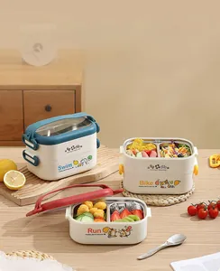Detail of multi-layered stainless steel lunch box with cartoon sport themes and handles
