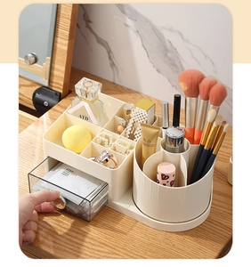 Detail of drawer makeup organizer with rotating brush holder and clear storage bin