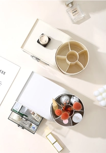 Top view of rotating multi-grid makeup organizer for skincare and brushes