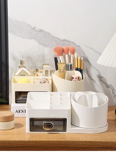 Detail of drawer makeup organizer with translucent bin and rotating brush holder section