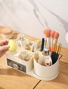 Detail view of drawer cosmetic organizer with 360-degree rotating makeup brush holder
