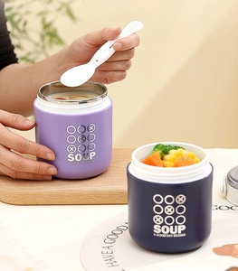 Detail of 304 stainless steel insulated soup cups in purple and navy blue with spoons