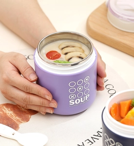 Close-up of portable insulated stainless steel soup jars with carry handle and spoon