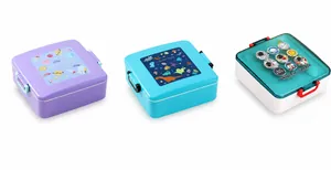 Three children's bento boxes with cartoon dinosaur and space themes on white background