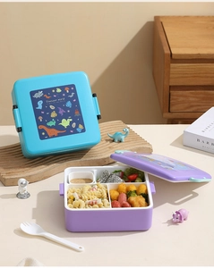 Vue détaillée de la boîte à bento avec motifs dinosaures et compartiments hermétiques