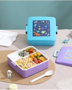 Détail d'une boîte à bento 4 compartiments pour enfants avec motifs dinosaure et espace
