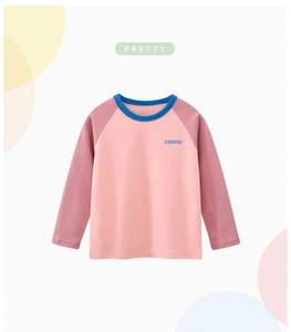 Detail of girls' long sleeve rainbow t-shirt with pink color block and blue crew neck