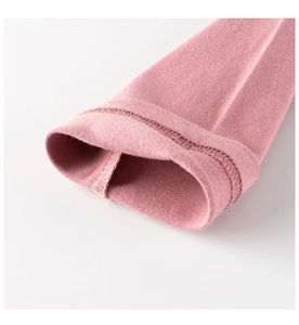 Detail of double-needle stitching on lotus pink long sleeve knit shirt cuffs
