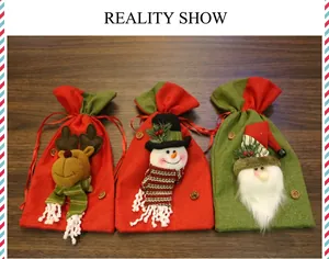 Three Christmas burlap drawstring bags with 3D reindeer, snowman and Santa designs