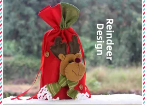 Detail of red Christmas burlap gift bag featuring a 3D plush reindeer with green ribbon bow