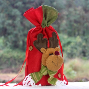 Christmas burlap gift bag featuring a 3D plush reindeer with green white striped scarf