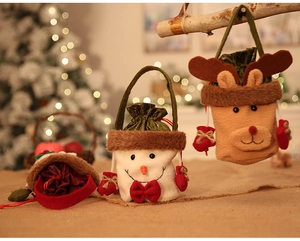 Detailed view of plush snowman and reindeer Christmas gift bags with soft drawstring closure