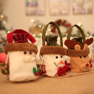 Christmas gift bags with Santa, Snowman, and Reindeer designs in a festive home setting