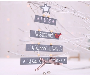 Christmas tree shaped wooden wall hanging with red bird, metal bell and plaid bow detail