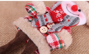 Close-up of Nordic style snowman plush ornament with knitting textures and fur details
