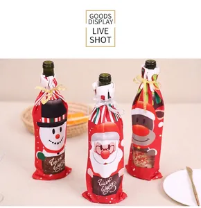 Detailed view of Christmas wine bottle covers with snowman, Santa, and elk patterns