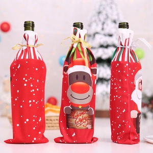 Three festive Christmas wine bottle covers featuring Santa, reindeer and snowflake designs