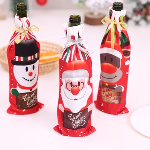 Three Christmas wine bottle covers with Santa Snowman and Reindeer prints and ribbons