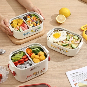 304 stainless steel cartoon lunch box with sports motif on a natural wood table