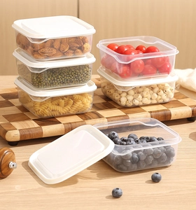 Stackable transparent food storage containers with white lids for organized kitchen pantry