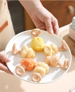Detail of DIY animal silicone ice cream molds in bear, cat, and rabbit shapes