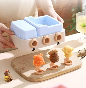 Detail showing silicone ice pop molds with cute bear and monkey animal shapes for DIY