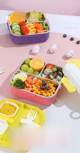 Macro detail of 4-compartment stainless steel bento box with built-in cutlery storage