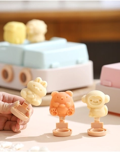Close-up of animal-shaped popsicles in bunny and bear shapes with silicone molds