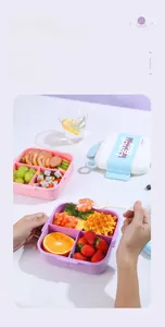 Divided lunch box with utensils shown packed with meat, fruit and fresh waffles