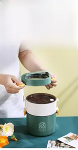 Dual-layer round portable lunch box with handle and airtight seal for food storage