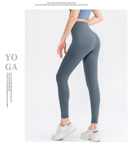 Vista detallada lateral trasera de pantalones de yoga de talle alto en color azul grisáceo