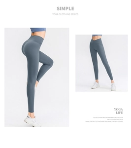 Vista detallada de leggings de yoga de cintura alta azul pizarra con costura levanta cola