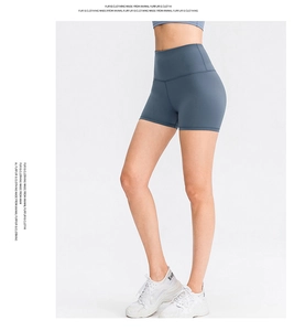 Side view of high-waisted navy yoga shorts with elastic seamless fabric and booty lift