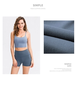 Detail view of misty blue yoga set fabric texture and high-waisted fitness shorts fit