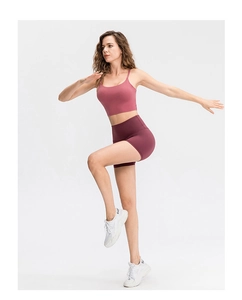 Detail of high-waist maroon compression yoga shorts with flexible and squat-proof fabric
