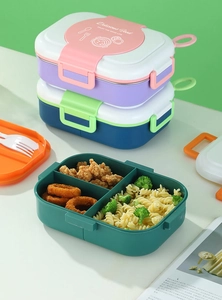 Detailed view of divided stainless steel lunch box with handle and three sections