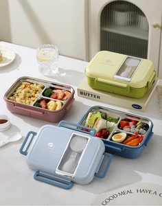 Detailed view of 304 stainless steel bento box with divided compartments and utensil storage