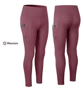 Detalle de mallas de yoga de talle alto marrón rojizo con bolsillos laterales para el móvil