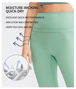 Macro view of mint green high-waisted yoga pants showing breathable and quick-dry fabric