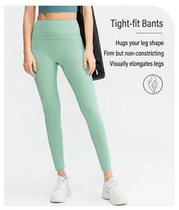 Detail of high waisted mint green yoga pants showing body contouring fit and elastic fabric