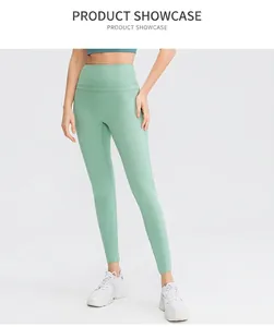 Detail of high-waisted mint green yoga leggings with flatlock seams and tummy control