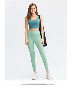 Full view of mint green high waist yoga pants and peacock blue sports vest for fitness