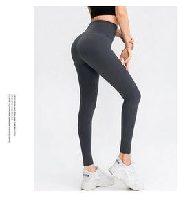 Detailed side view of dark grey high-waisted yoga leggings with seamless waistband
