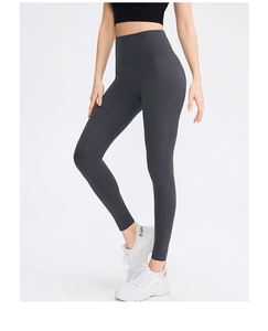 Detail of high waisted dark grey yoga pants with wide waistband for tummy control